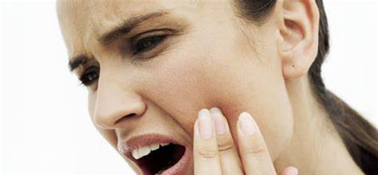 Woman having Tooth Pain